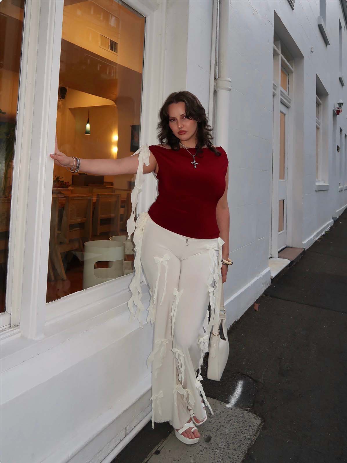 Bow Down embellished straight-leg trousers