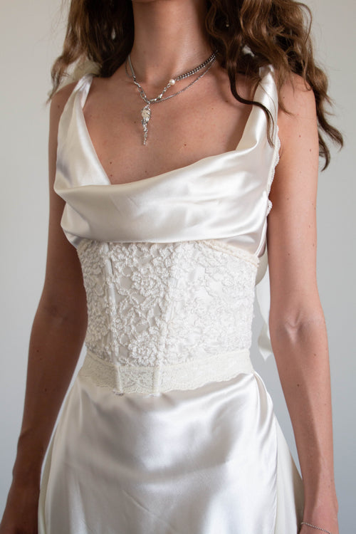 Close up for two-piece corset mini dress in white. Features the Pearlescent multi-wear mini dress and Oyster underbust waist corset.